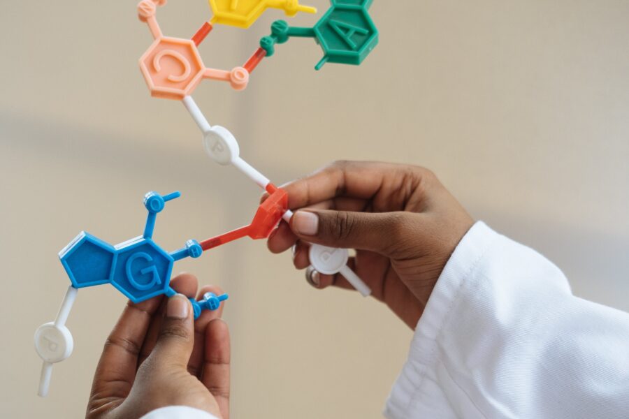 scientist holding a chemical structure