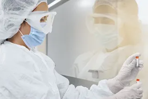 scientist with a vial