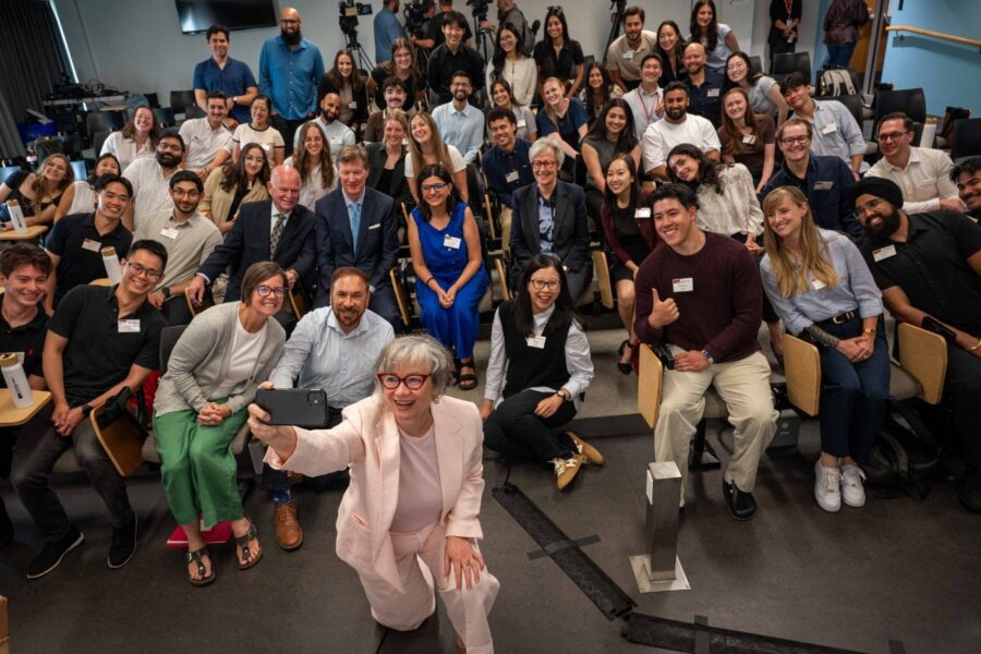 Jennifer Whiteside, Minister of Labour, poses for a selfie with the first cohort of students, as well as SFU President Joy Johnson and David Price